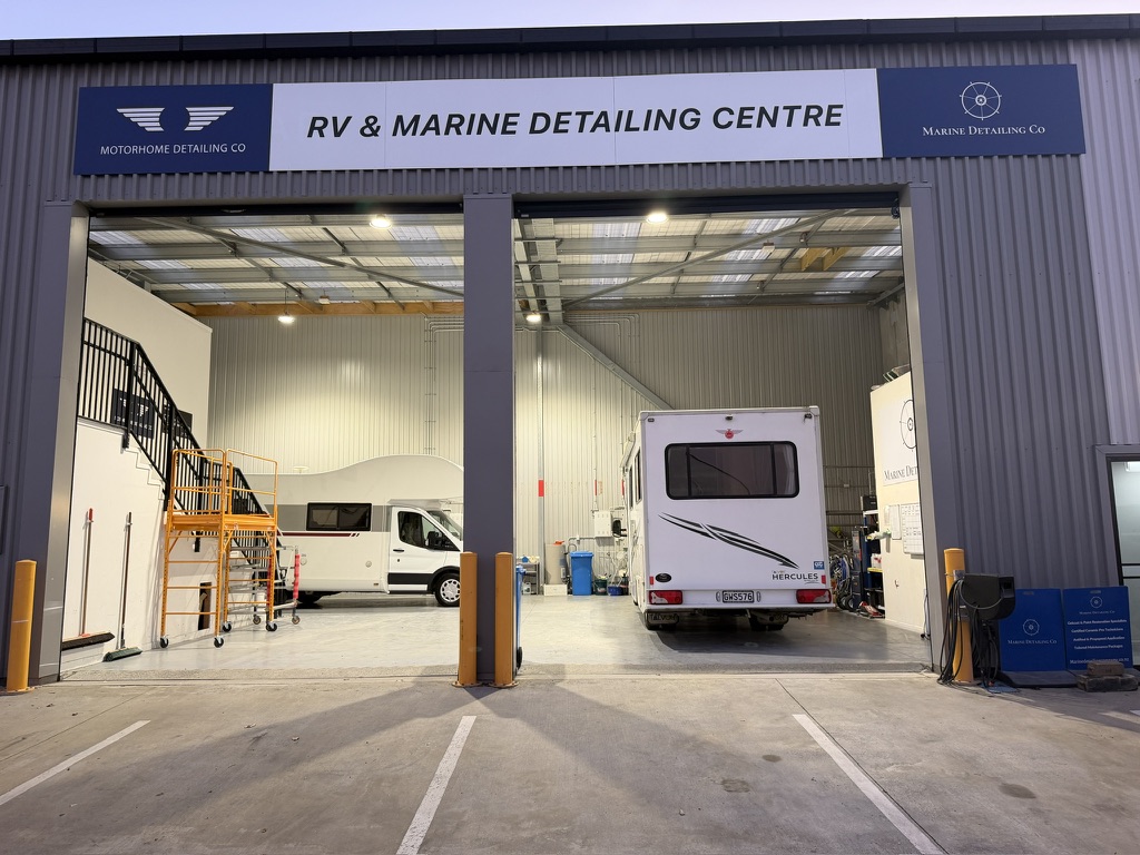Motorhome Detailing Co team working on a motorhome inside the Mt Wellington workshop